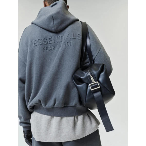 Fear of God Essentials Embossed 90s Relaxed Zip-Up Hoodie in Warm Heather | Sweatshirts | Coveti