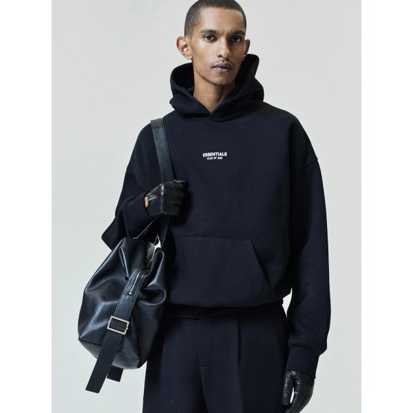 Fear of God Essentials Front Logo Classic Hoodie in Black | Sweatshirts | Coveti