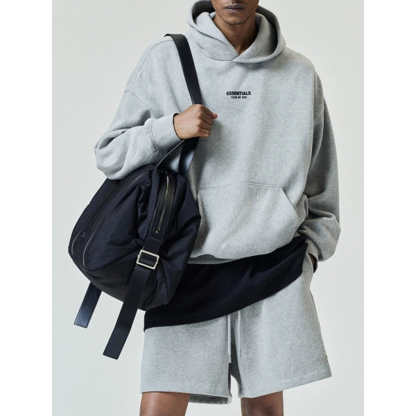 Fear of God Essentials Front Logo Classic Hoodie in Warm Heather | Sweatshirts | Coveti