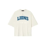 Fear of God Essentials Lions 90s 3/4 Sleeve Football Tee in Cream White | Coveti