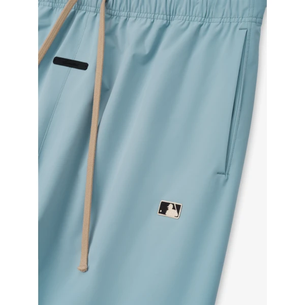 Fear of God Essentials MLB Relaxed Track Pant in Stone Blue | Pants | Coveti