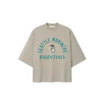 Fear of God Essentials Mariners American League Merch Tee in Seal | Coveti