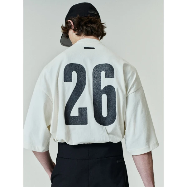 Fear of God Essentials Merch Tee Boxy Fit in Ivory | T-shirts & vests | Coveti