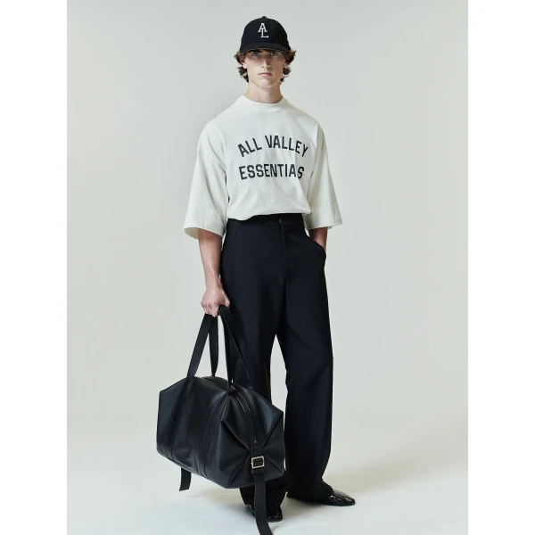 Fear of God Essentials Merch Tee Boxy Fit in Ivory | T-shirts & vests | Coveti