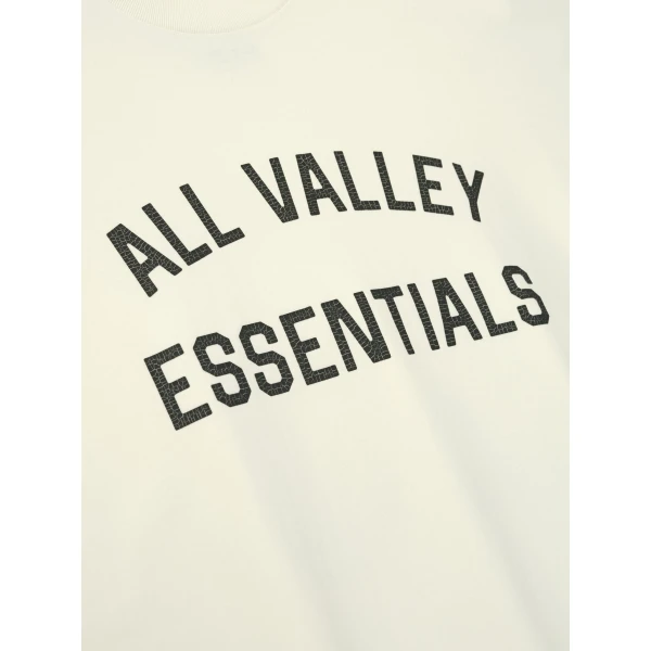 Fear of God Essentials Merch Tee Boxy Fit in Ivory | T-shirts & vests | Coveti
