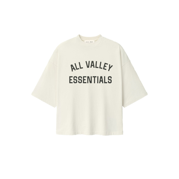 Fear of God Essentials Merch Tee Boxy Fit in Ivory | Coveti