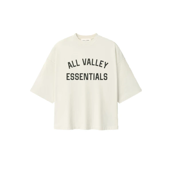 Fear of God Essentials Merch Tee Boxy Fit in Ivory | Coveti