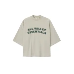 Fear of God Essentials Merch Tee Boxy Fit in Vanilla Heather | Coveti