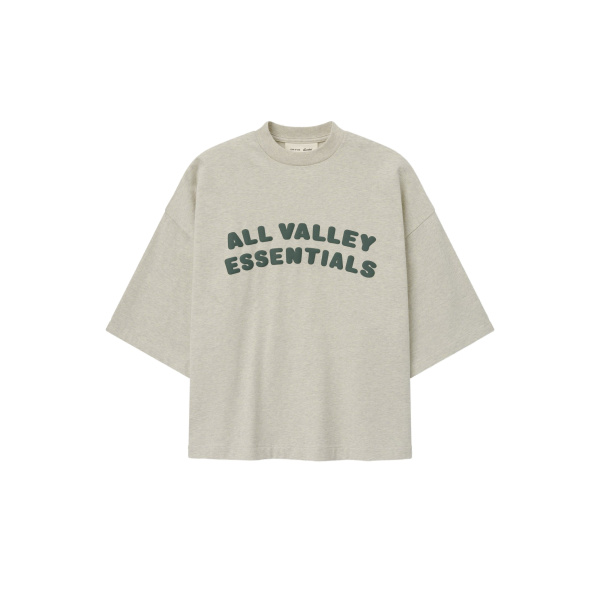 Fear of God Essentials Merch Tee Boxy Fit in Vanilla Heather | Coveti