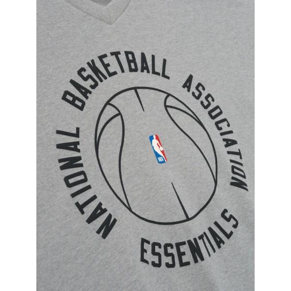 Fear of God Essentials NBA x Barkley Hendricks Long Sleeve V-Neck Tee in Concrete Heather | T-shirts & vests | Coveti