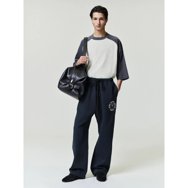 Fear of God Essentials NBA x Barkley Hendricks Tearaway Sweatpant in Faded Black | Pants | Coveti