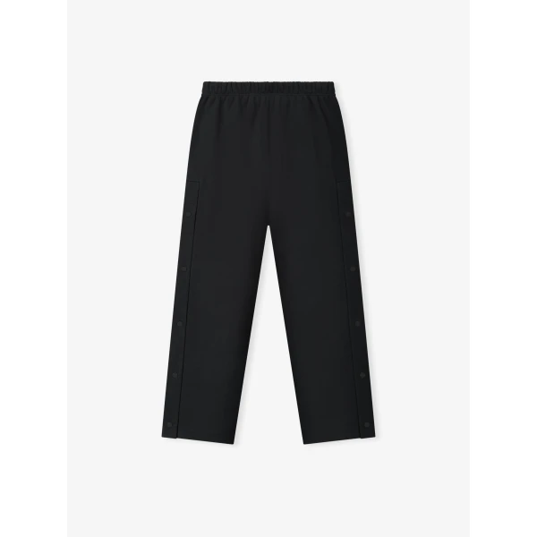 Fear of God Essentials NBA x Barkley Hendricks Tearaway Sweatpant in Faded Black | Pants | Coveti