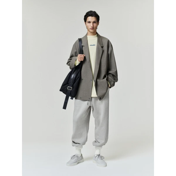 Fear of God Essentials Panelled Modern Long Sleeve Tee in Washed Sulphur | T-shirts & vests | Coveti