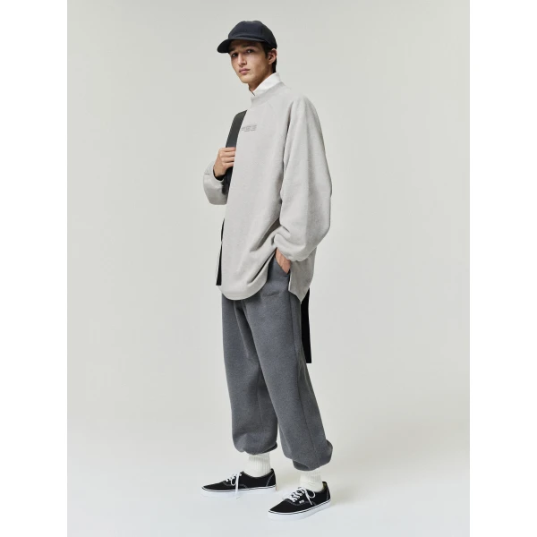 Fear of God Essentials Pique 90s Relaxed Mockneck Raglan Long Sleeve Tee in Pyrite Heather | T-shirts & vests | Coveti