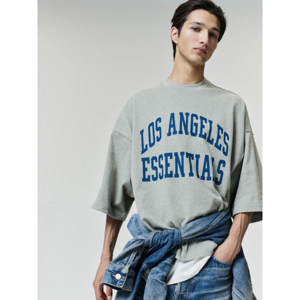Fear of God Essentials Rams Merch Tee in Seal Heather | T-shirts & vests | Coveti
