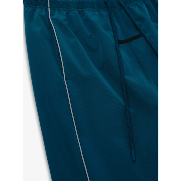 Fear of God Essentials Ripstop Classic Track Pant in Night Sea | Pants | Coveti