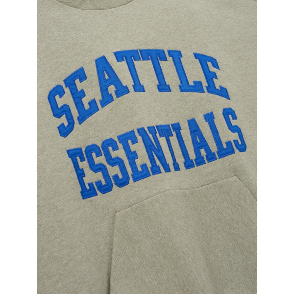 Fear of God Essentials Seahawks 90s Relaxed Crewneck in Seal Heather | Sweatshirts | Coveti