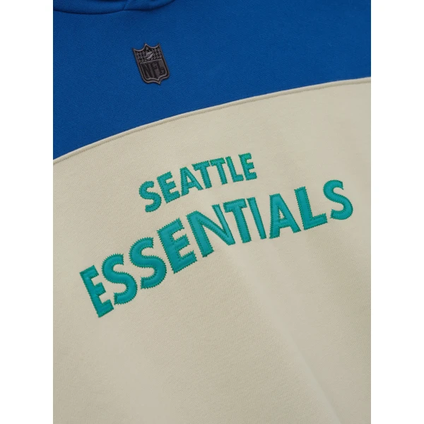 Fear of God Essentials Seahawks 90s Relaxed Hoodie in Sandstone | Sweatshirts | Coveti