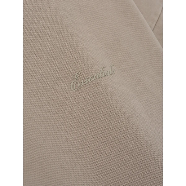 Fear of God Essentials Signature 90s Relaxed Long Sleeve Tee in Washed Stone | T-shirts & vests | Coveti