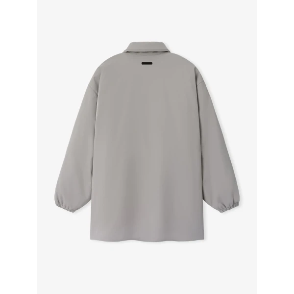 Fear of God Essentials Signature Bonded Nylon Filled Barn Jacket in Stone | Men Jackets | Coveti