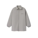 Fear of God Essentials Signature Bonded Nylon Filled Barn Jacket in Stone | Coveti