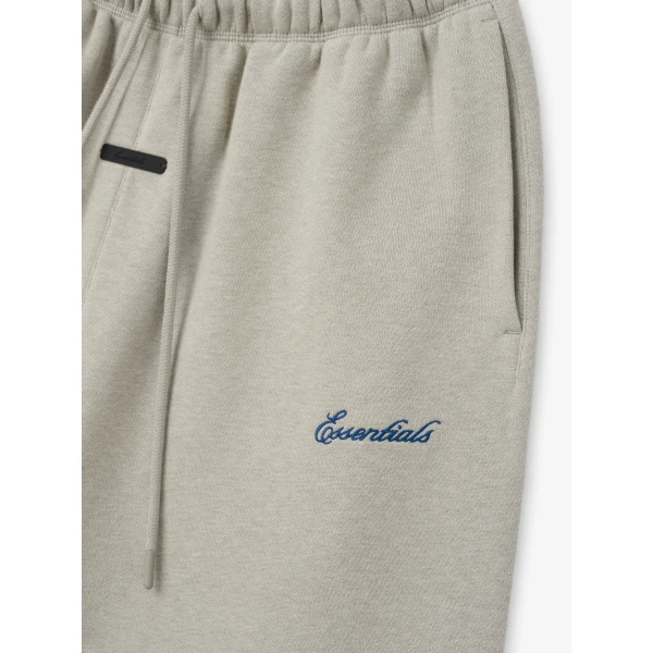 Fear of God Essentials Signature Classic Fit Flare Sweatpant in Pyrite Heather | Pants | Coveti