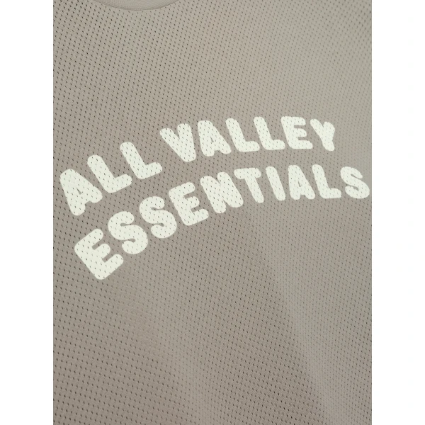 Fear of God Essentials Sport Mesh Merch Long Sleeve Tee in Seal | T-shirts & vests | Coveti