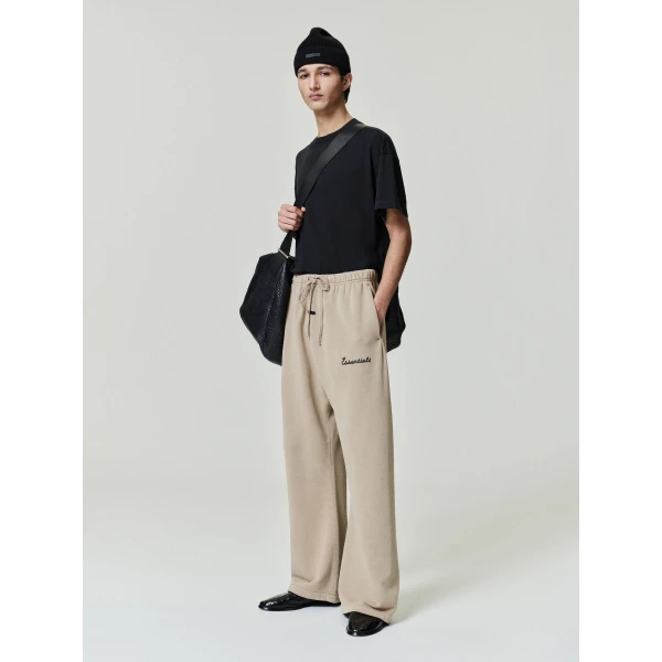 Fear of God Essentials Training Classic Flare Sweatpant in Faded Dune | Pants | Coveti