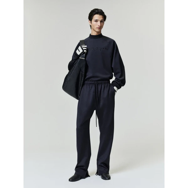 Fear of God Essentials Tricot 90s Relaxed Long Sleeve Mock Neck in Black | T-shirts & vests | Coveti