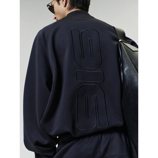 Fear of God Essentials Tricot Classic Trackpant in Black | Pants | Coveti
