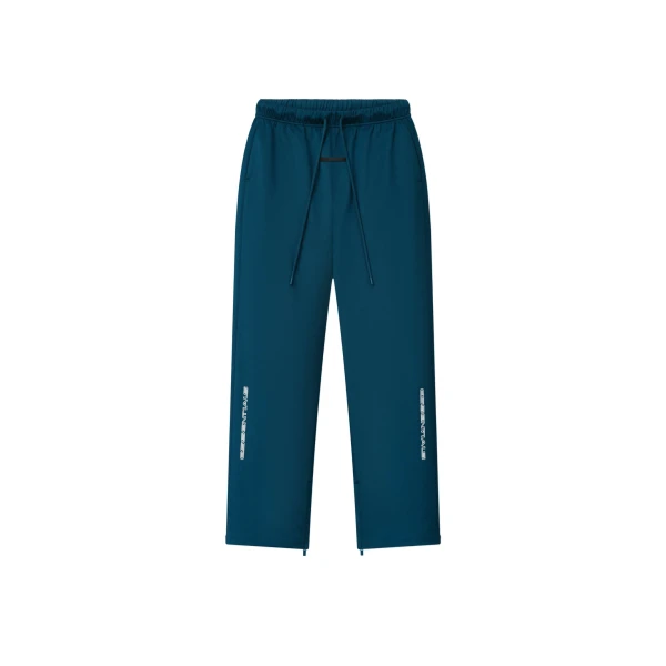 Fear of God Essentials Tricot Classic Trackpant in Night Sea | Coveti