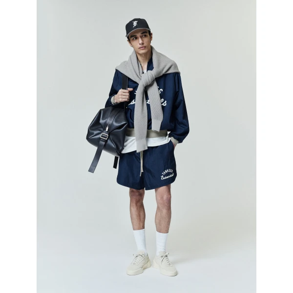 Fear of God Essentials Yankees Gym Short in Dark Sapphire | Shorts | Coveti