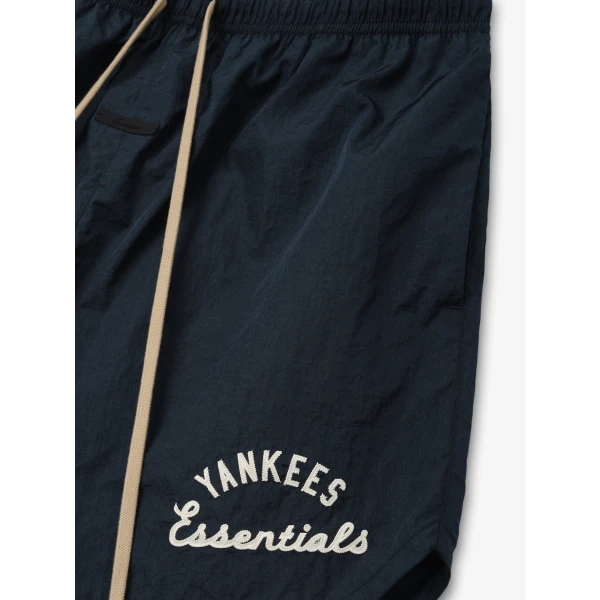Fear of God Essentials Yankees Gym Short in Dark Sapphire | Shorts | Coveti