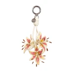 JW PEI 3D Embroidered Lily Bag Charm in Pink Yellow | Bag Charms | Coveti