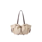 JW PEI Corinne Canvas Drawstring Tote Bag in Beige | Totes & Top-Handle Bags | Coveti