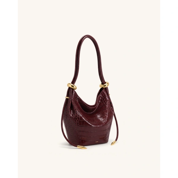JW PEI Ellie Metal Ring Embellished Bucket Bag in Burgundy Croc | Bucket Bags | Coveti