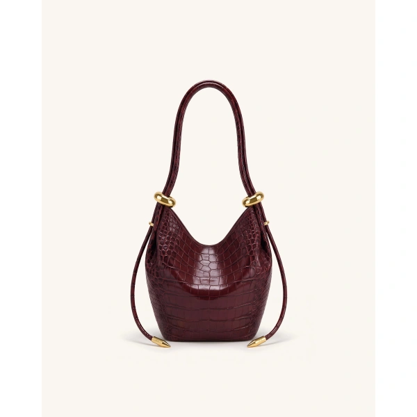 JW PEI Ellie Metal Ring Embellished Bucket Bag in Burgundy Croc | Bucket Bags | Coveti