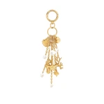 JW PEI Ocean Creature Faux Pearl Bag Charm in Gold | Bag Charms | Coveti