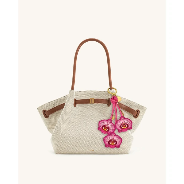 JW PEI Orchid Bag Charm in Pink | Bag Charms | Coveti