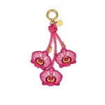 JW PEI Orchid Bag Charm in Pink | Bag Charms | Coveti