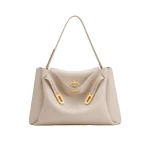 JW PEI Rhea Large Pebbled Double Buckle Shoulder Bag in Light Beige | Shoulder & Crossbody Bags | Coveti