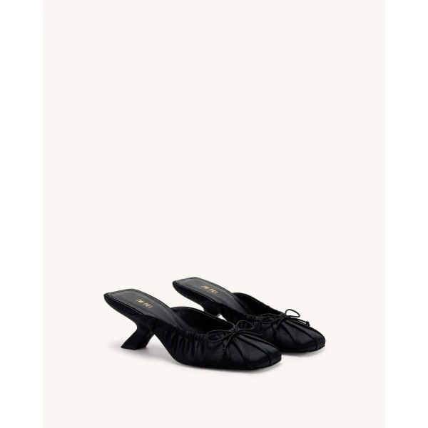 JW PEI Solenne Satin Bow Ruched Mules in Black | Mules | Coveti