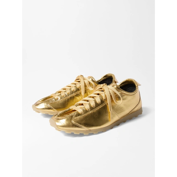 Jacquemus The Tennis Sneakers in Gold | Sneakers | Coveti