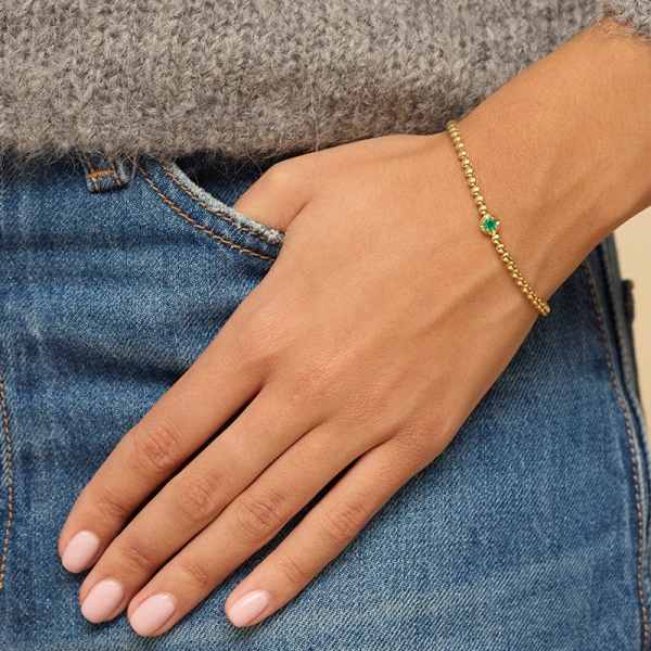 Jennifer Meyer Bezel Tennis Bracelet With Illusion Set Emerald Center in 18K Yellow Gold | Fine Bracelets | Coveti