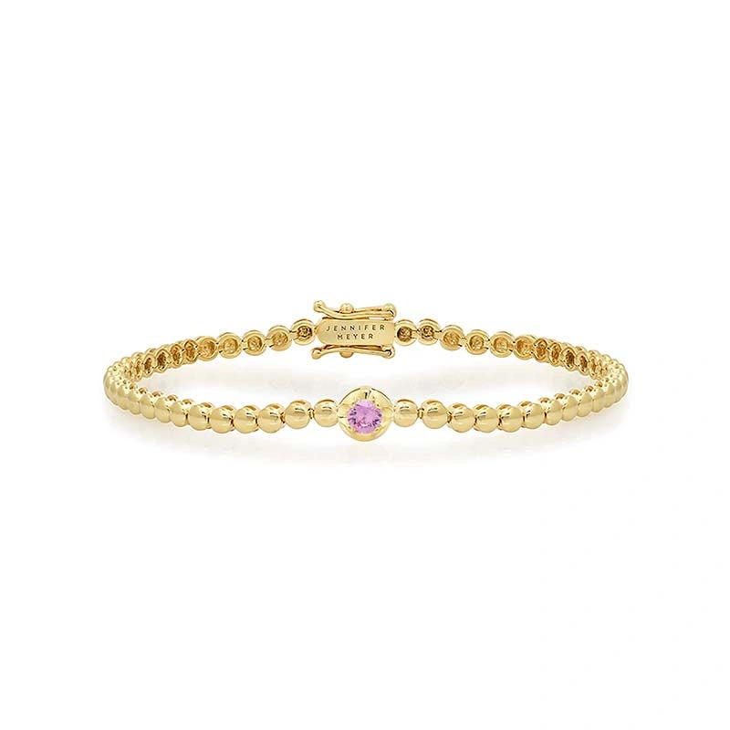 Jennifer Meyer Bezel Tennis Bracelet With Illusion Set Pink Sapphire Center in 18K Yellow Gold Jennifer Meyer Bezel Tennis Bracelet With Illusion Set Pink Sapphire Center in 18K Yellow Gold | Fine Bracelets | Coveti