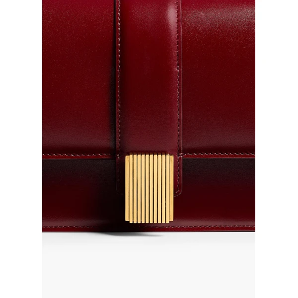 Khaite Blake Clutch in Oxblood | Clutch Bags | Coveti