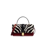 Khaite Blake Top Handle Bag in Zebra Print Haircalf and Oxblood Leather | Totes & Top-Handle Bags | Coveti