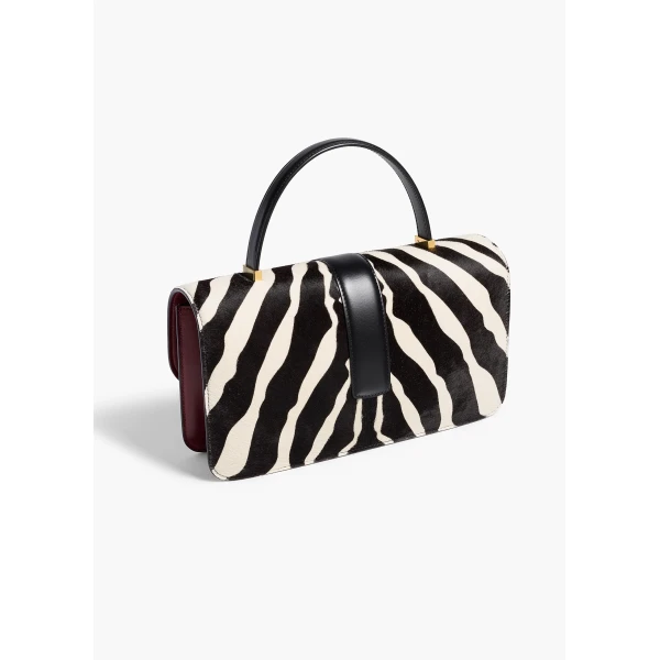 Khaite Blake Top Handle Bag in Zebra Print Haircalf and Oxblood Leather | Totes & Top-Handle Bags | Coveti