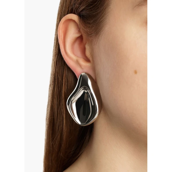 Khaite Cove Earrings in Silver | Earrings | Coveti