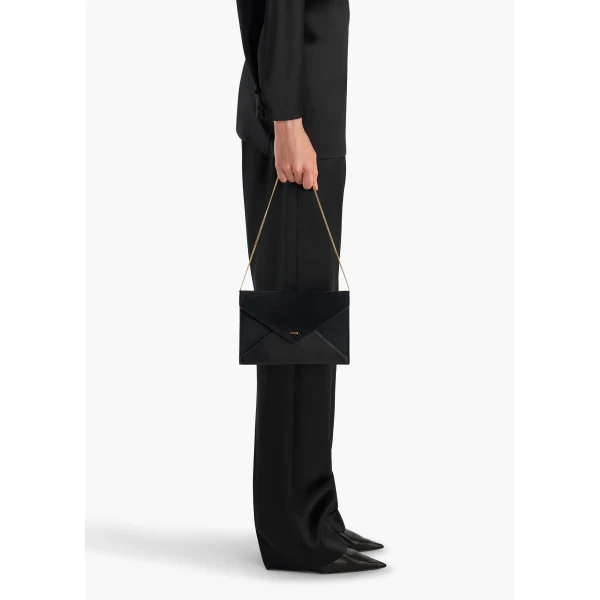 Khaite Grace Envelope Clutch in Black | Clutch Bags | Coveti